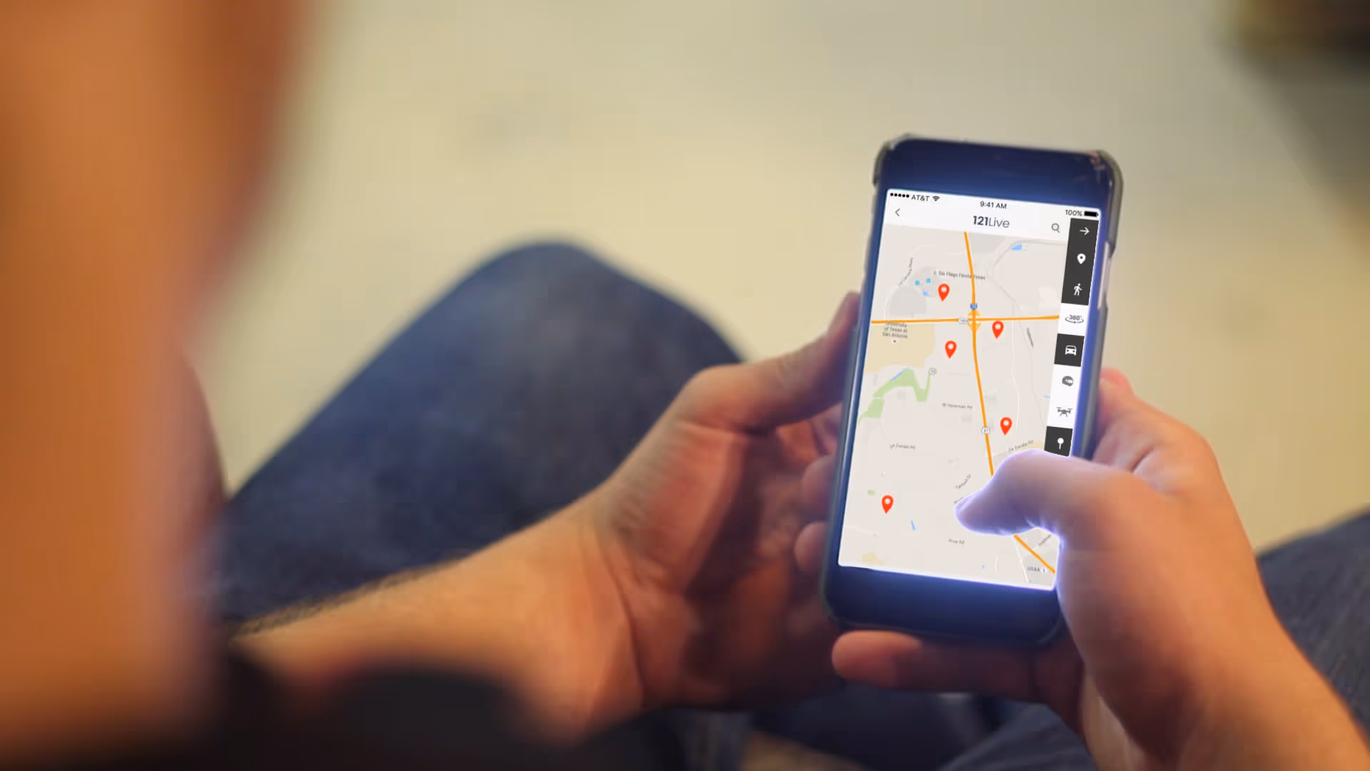 A phone with the '121 Live' app running