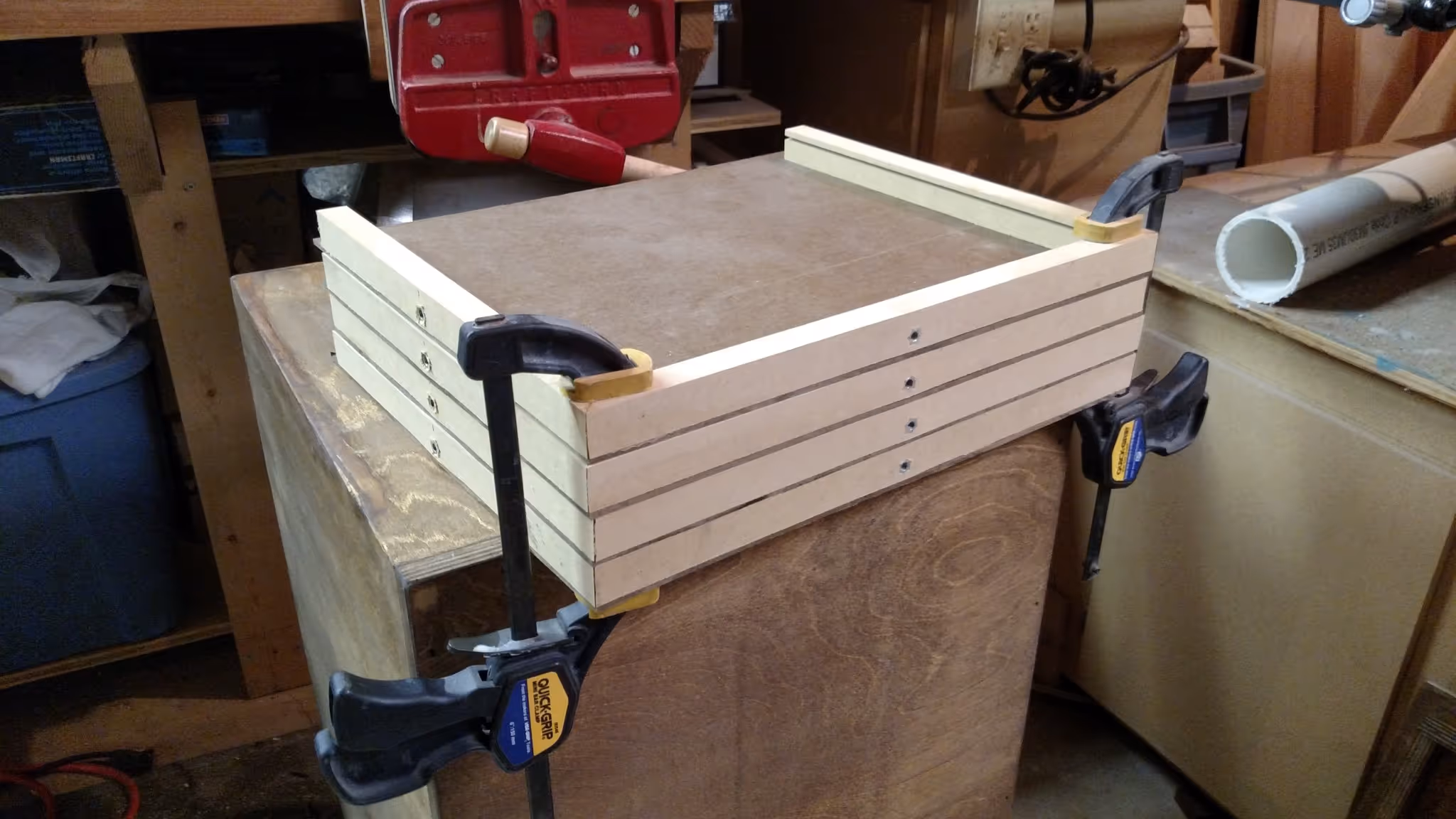 Four pieces of wood being clamped together