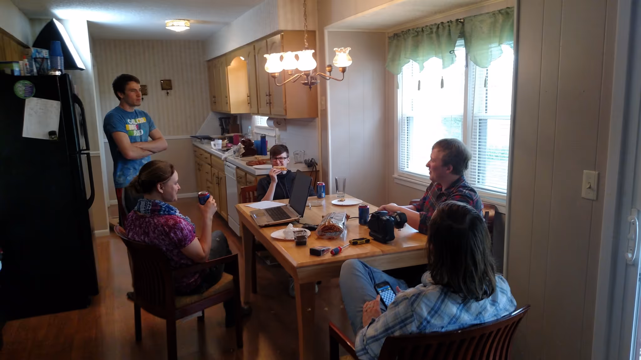 The crew of the film around a table planning.