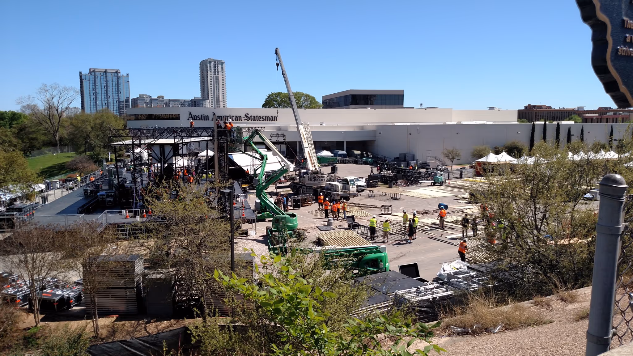 A work crew setting up a stage