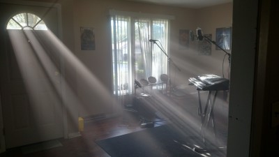 A foggy room with light rays going through the fog