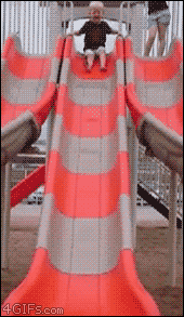 A GIF of a girl going down a slide