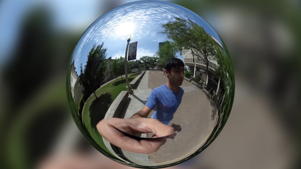 A 360 degree panoramic image of a person walking on a college campus