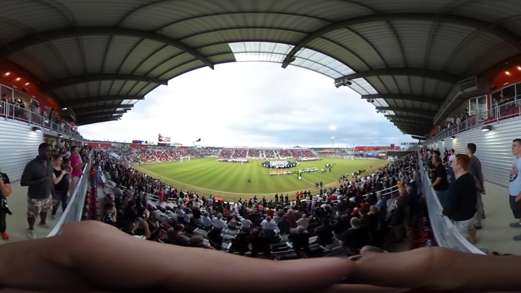 A panoramic picture of a soccer game